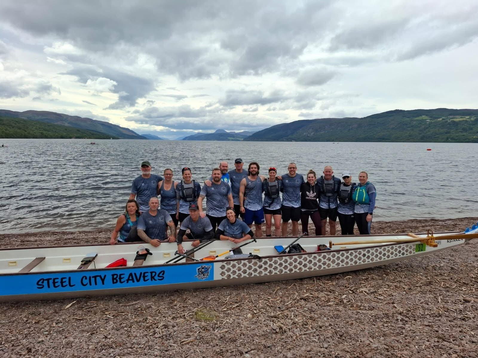 Steel City Beavers with their boat on the shore of Loch Ness